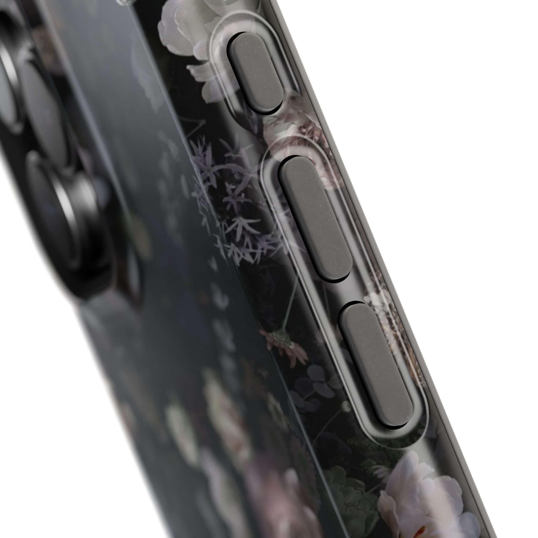 Midnight Curse Black Floral MagSafe iPhone Case with elegant black roses design, close-up view of side buttons and floral pattern.