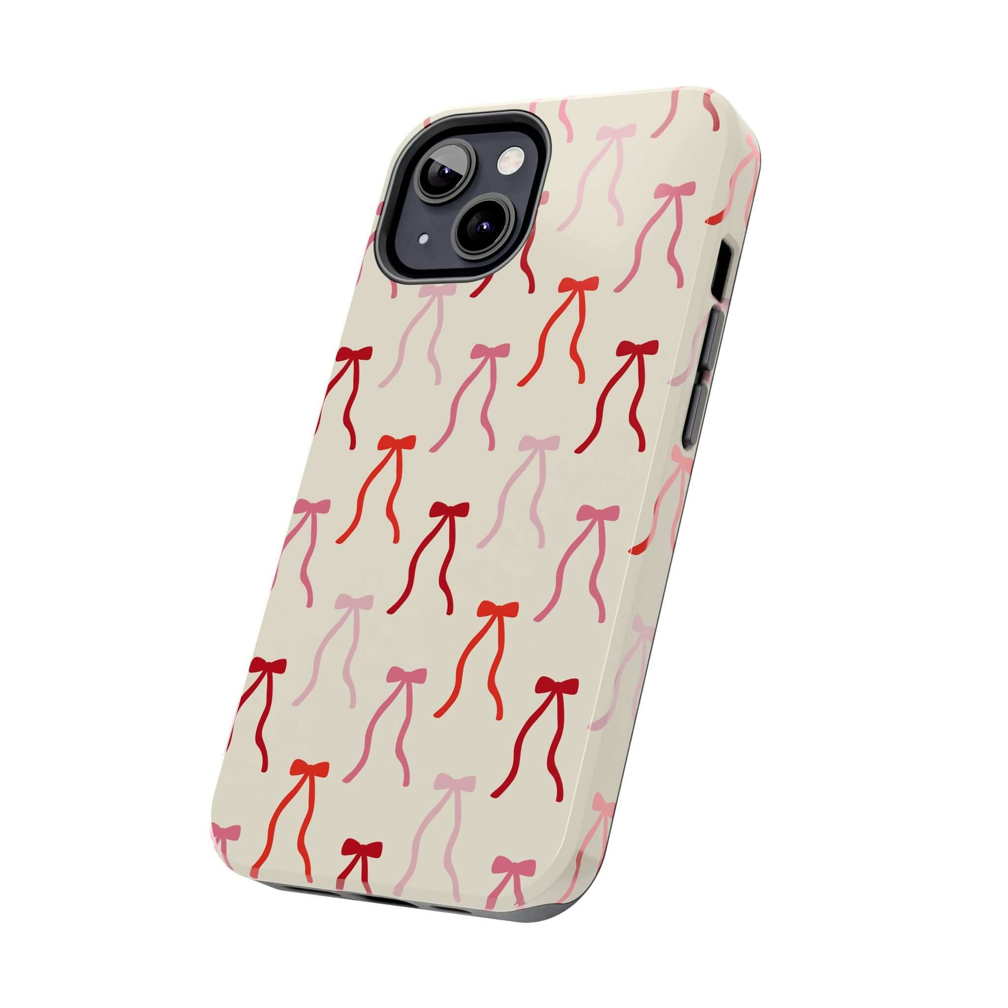 Beige Coquette Case for iPhone 16 featuring cute red bow design, playful and protective phone case for style-conscious users.