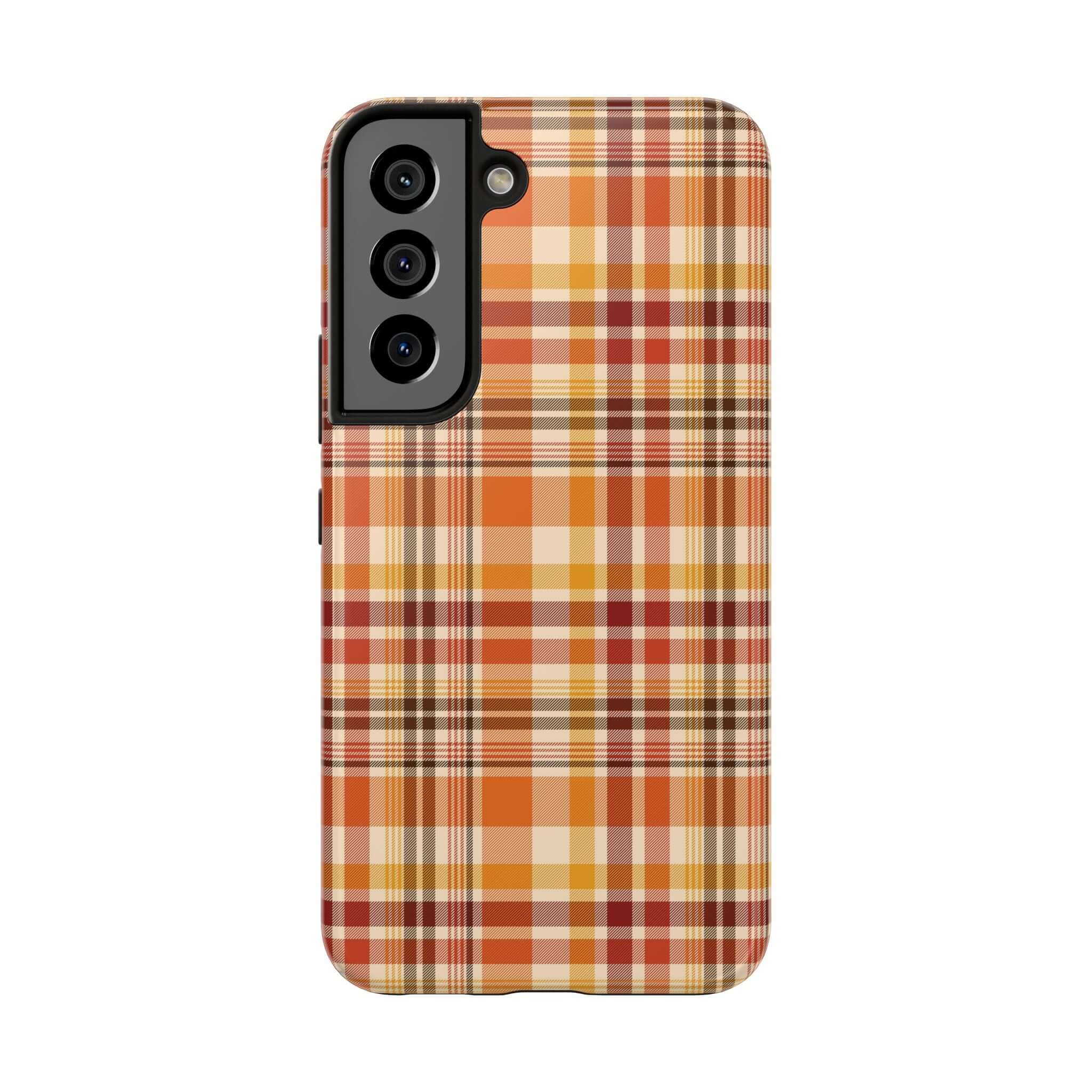 Plaid autumn-themed phone case with orange and brown colors, perfect for fall and Halloween. Cute fall iPhone case for stylish protection.