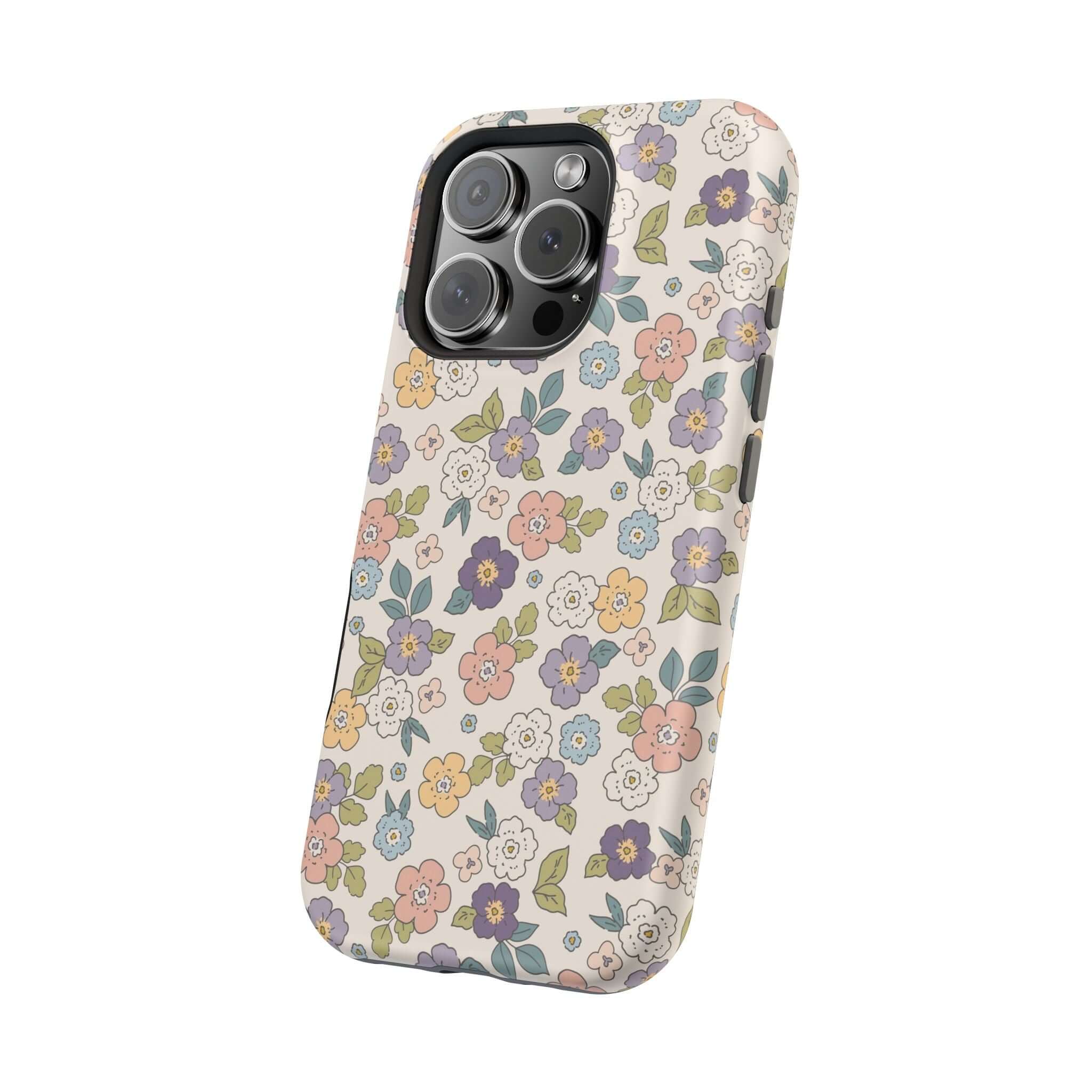 Colorful floral iPhone case featuring pink, blue, and yellow daisies, perfect for stylish beachy vibes and cute phone cover lovers.