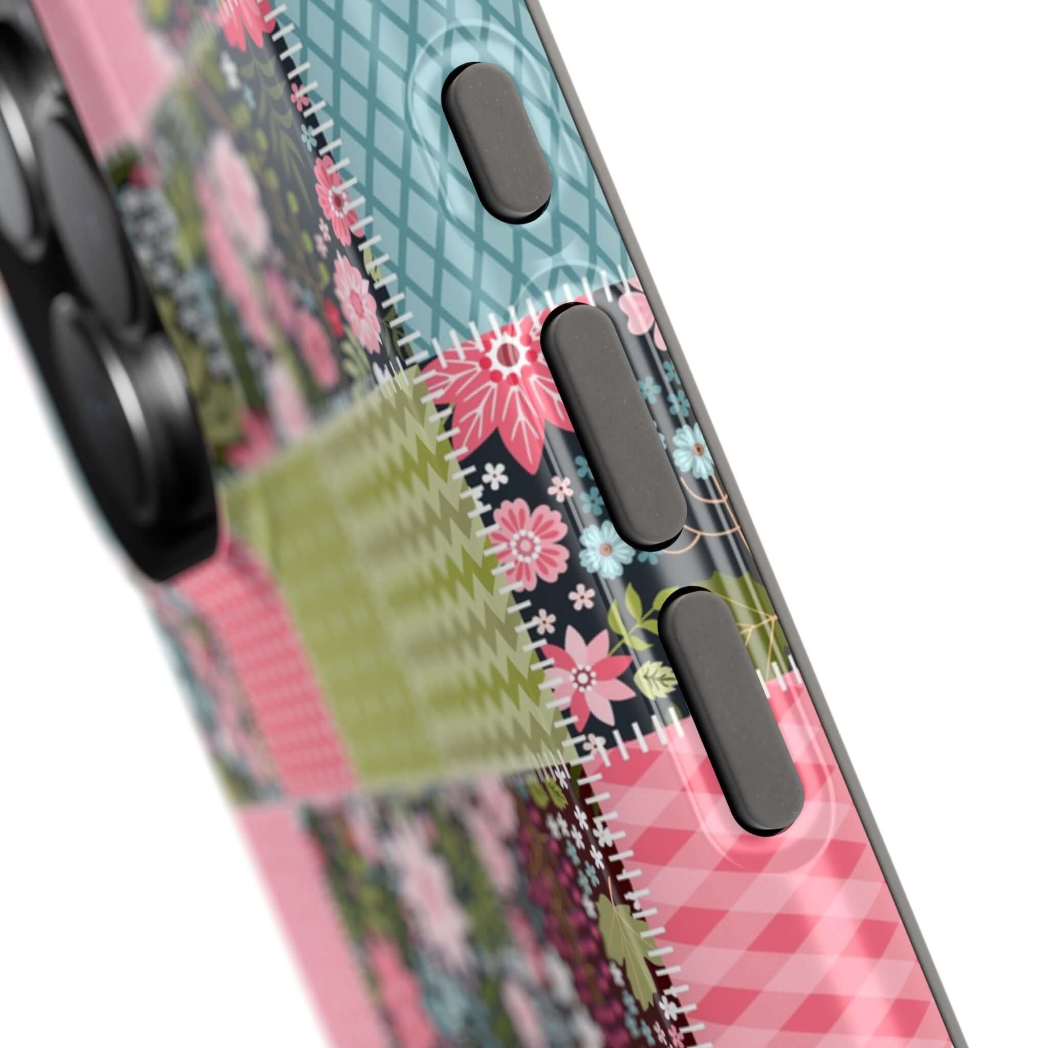 Close-up of Flora Forage Wildflower Patchwork MagSafe iPhone case with floral patterns in pink, blue, and green.