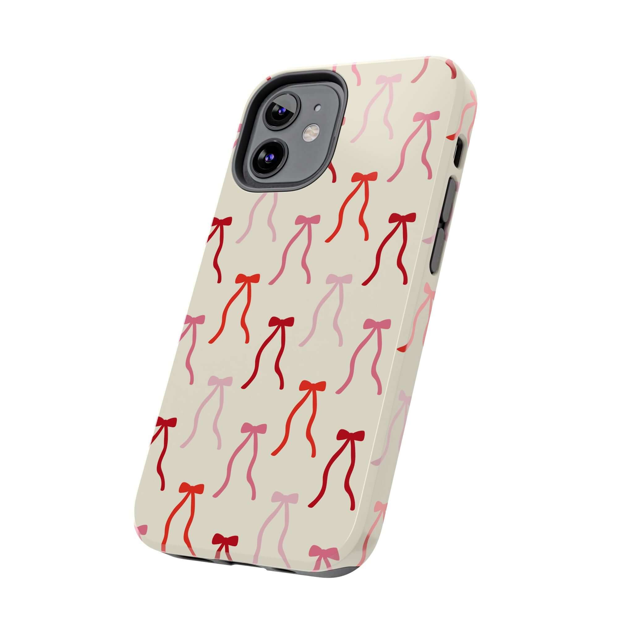 Beige Coquette Case with red bow design for iPhone 16, playful and cute phone case protection.