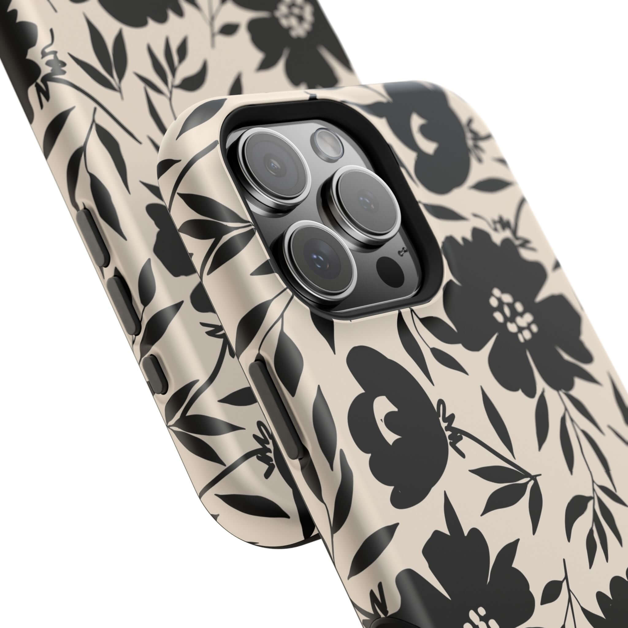 Black floral iPhone 16 case with bold pattern, perfect cute phone case accessory for adding fantasy to your everyday style.