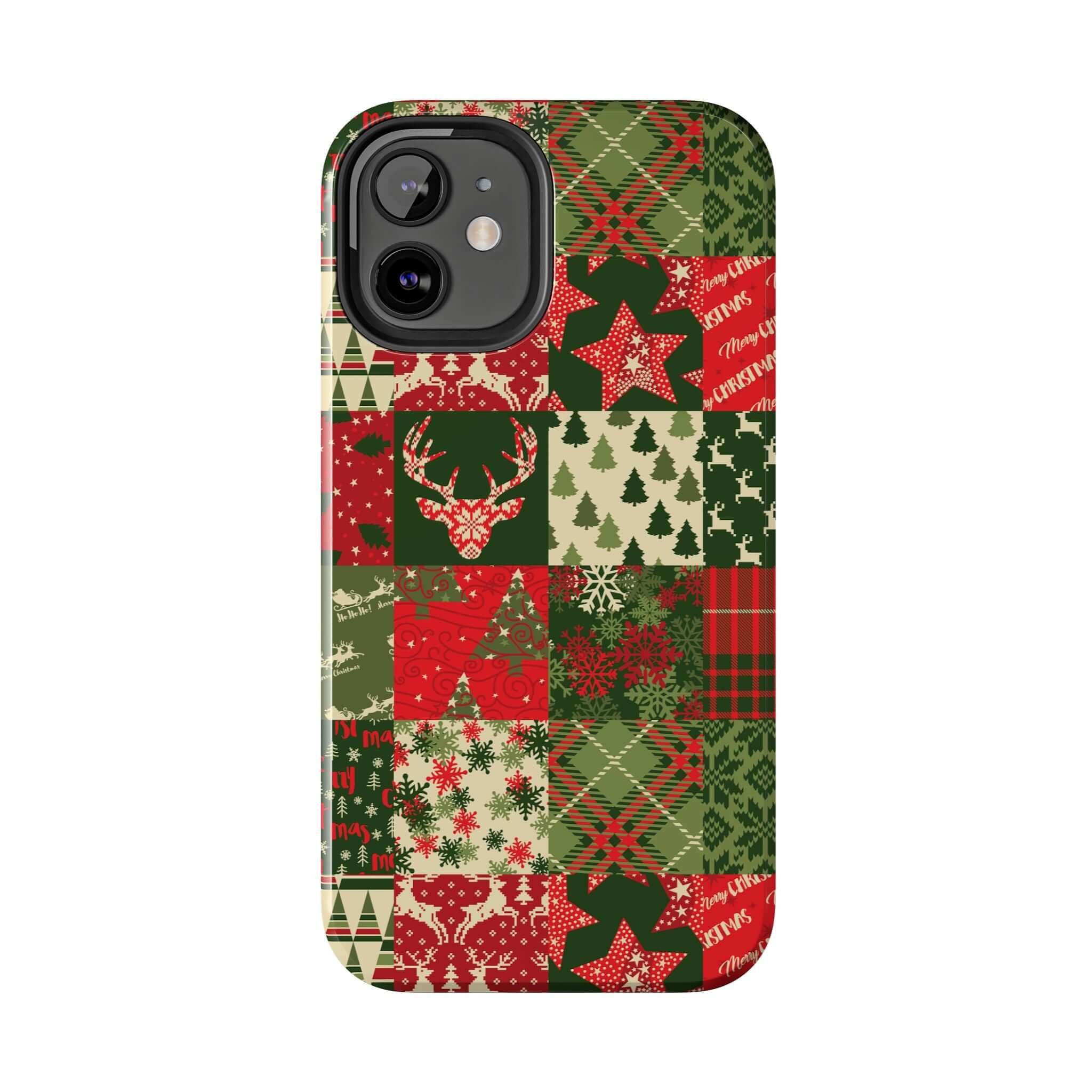 Festive Christmas-themed green iPhone case with patchwork design featuring trees, reindeer, and snowflakes from Cozy Quiltmas.