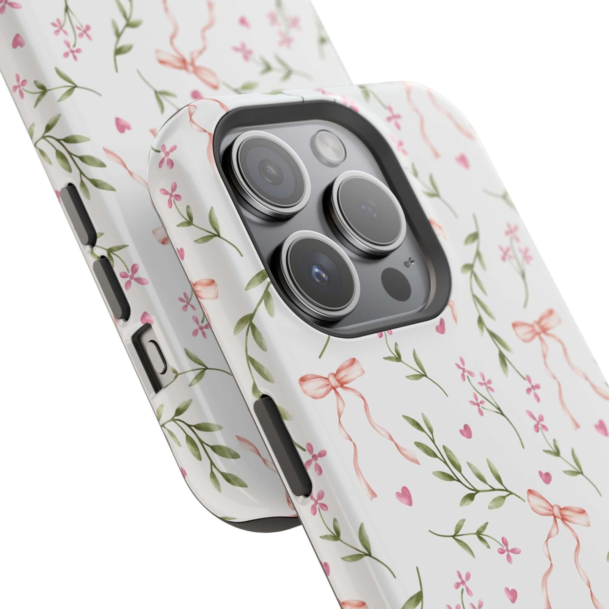 Stylish MagSafe iPhone case with pink bows and floral design on the Darling Daydream Pink Coquette Case, perfect for a cute phone cover.