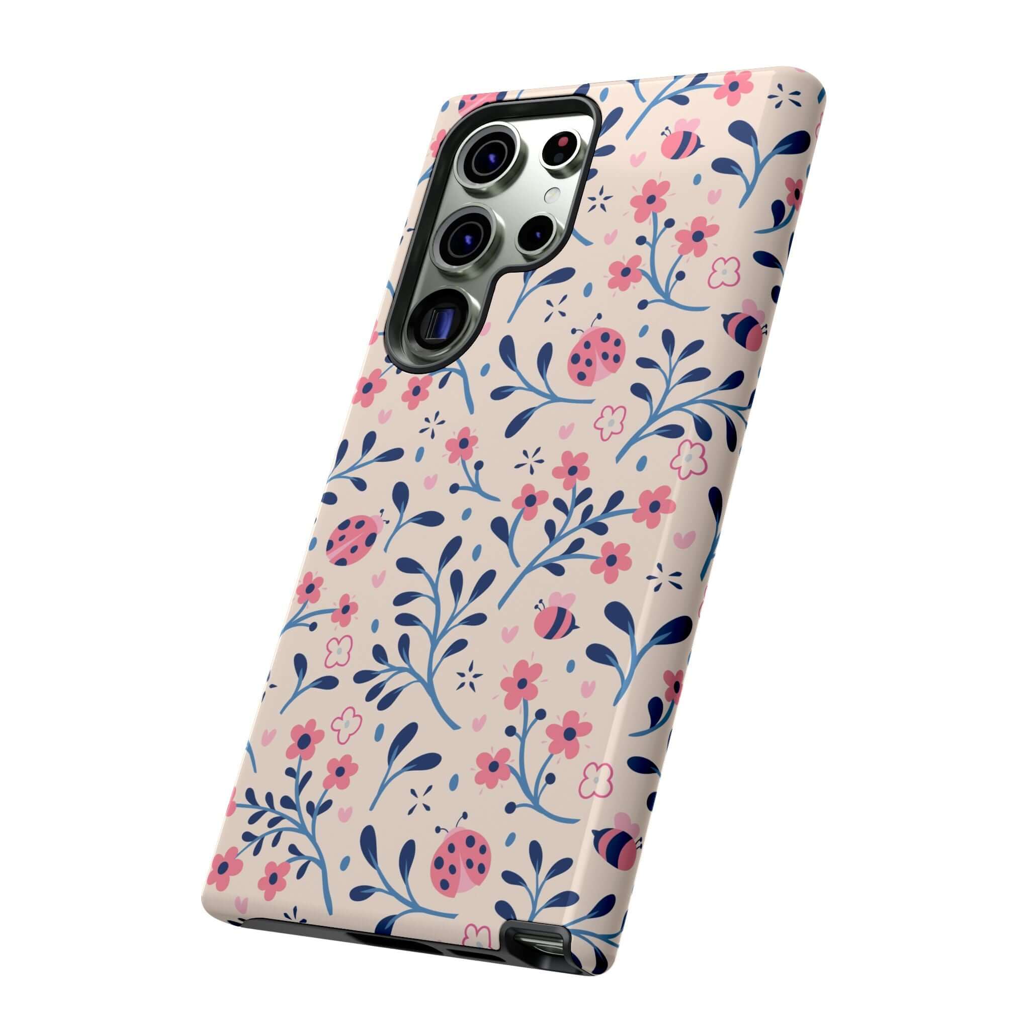 Samsung phone with colorful floral ladybug case, perfect for iPhone 14 Pro Max, trendy cute phone cases.