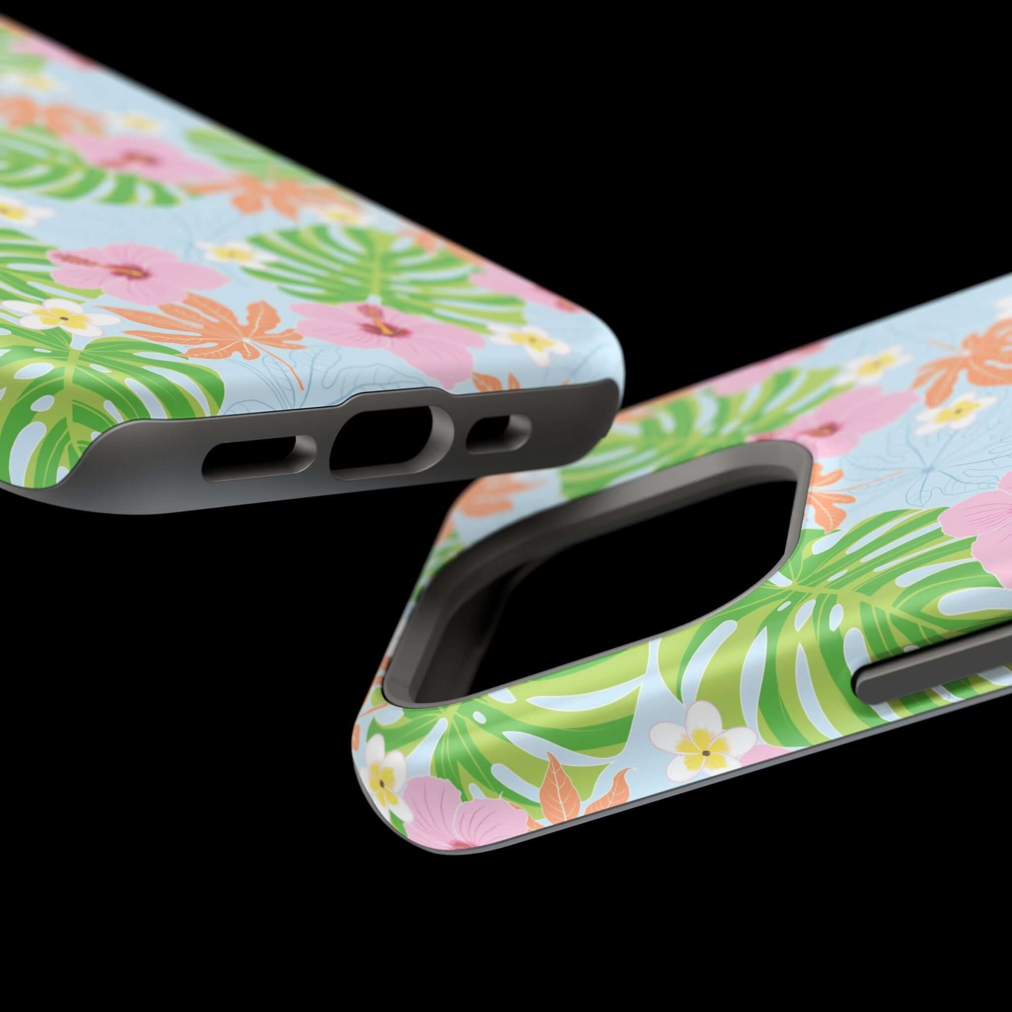 Close-up view of Island Hibiscus MagSafe iPhone 14 Pro case with tropical floral design on a black background.