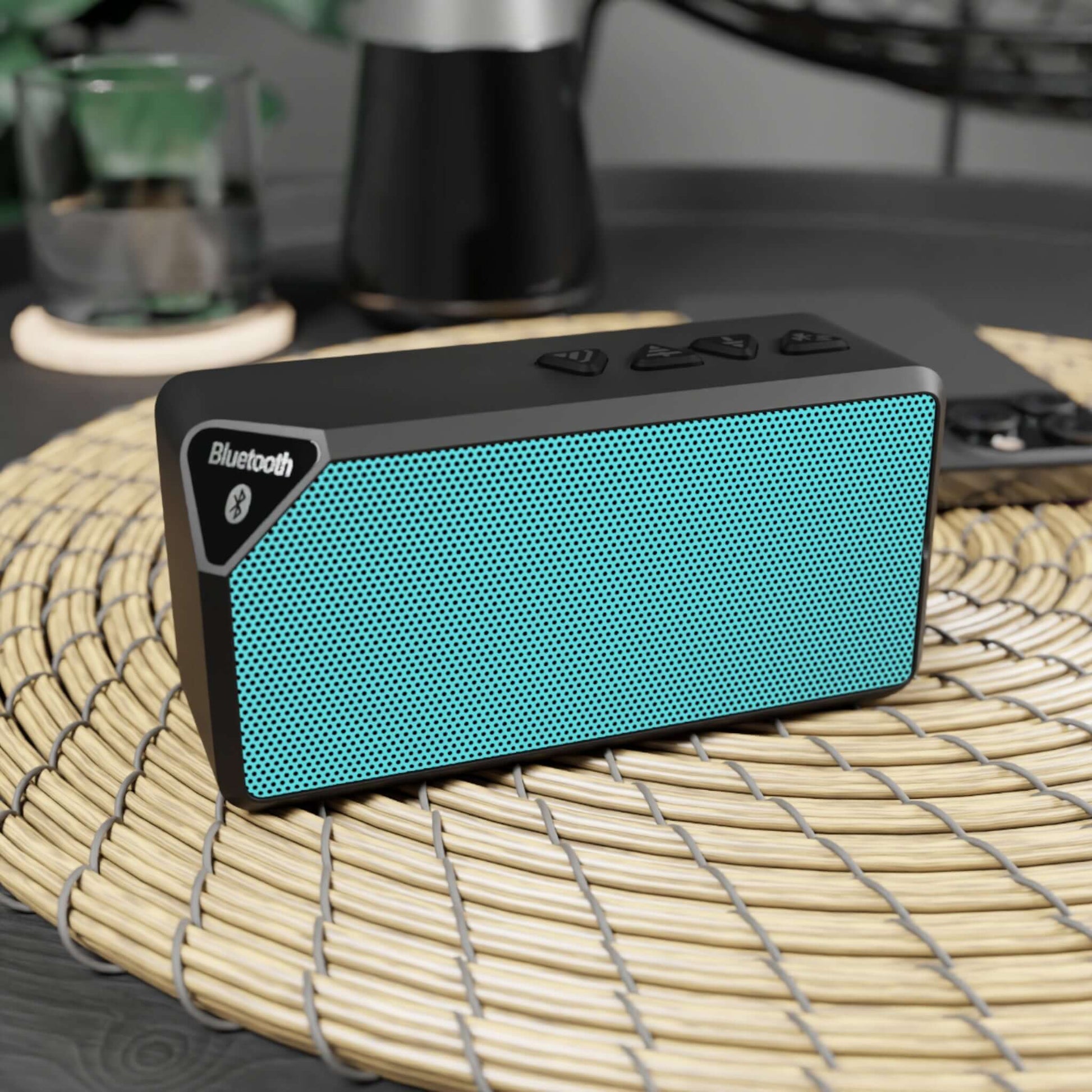 Teal Bluetooth speaker on wicker mat, perfect for holidays, featuring 2-hour playtime and 33-foot range, ideal for Christmas gifts.