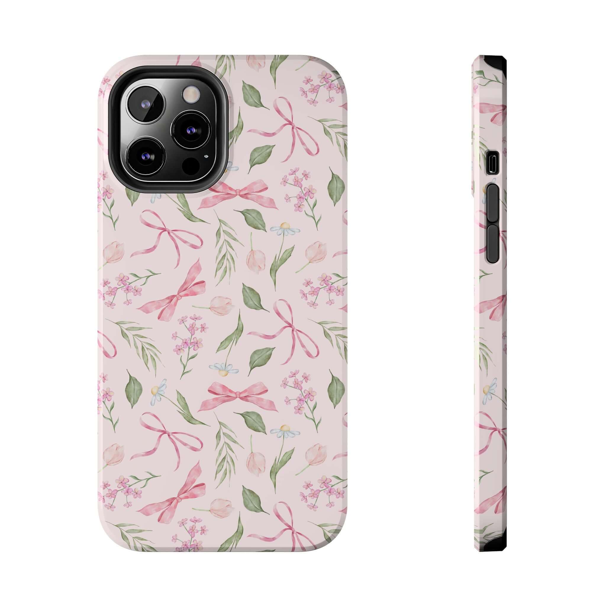 Pink iPhone case with cute bow and floral design, perfect for iPhone 14 and iPhone 15. Girly Twirls Coquette Bow Case for fun and stylish protection.