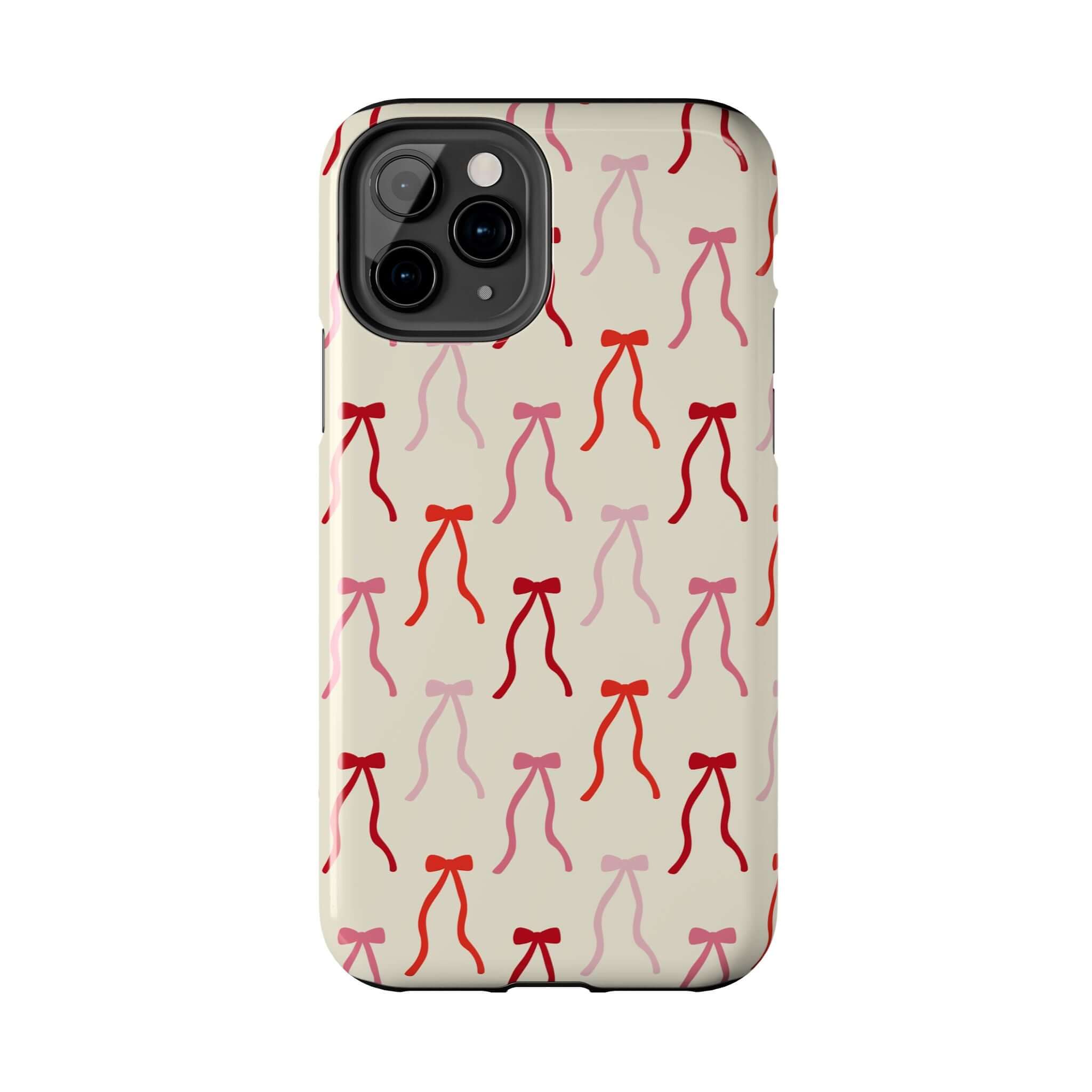 Beige Coquette Case with red and pink bow design for iPhone 16, a cute phone case offering style and protection.