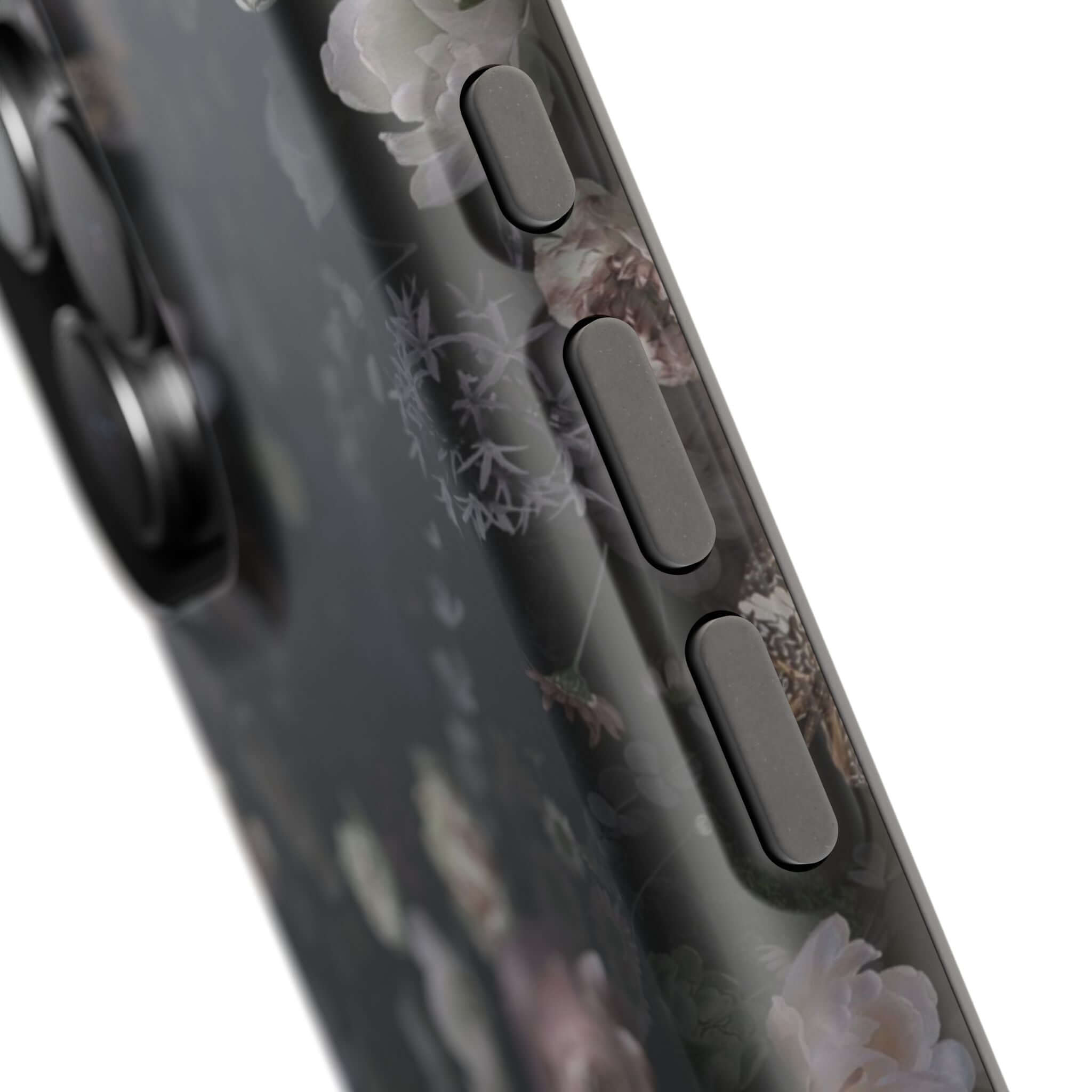 Close-up of Midnight Curse Black Floral MagSafe iPhone Case, showcasing detailed floral patterns on sleek button cutouts.