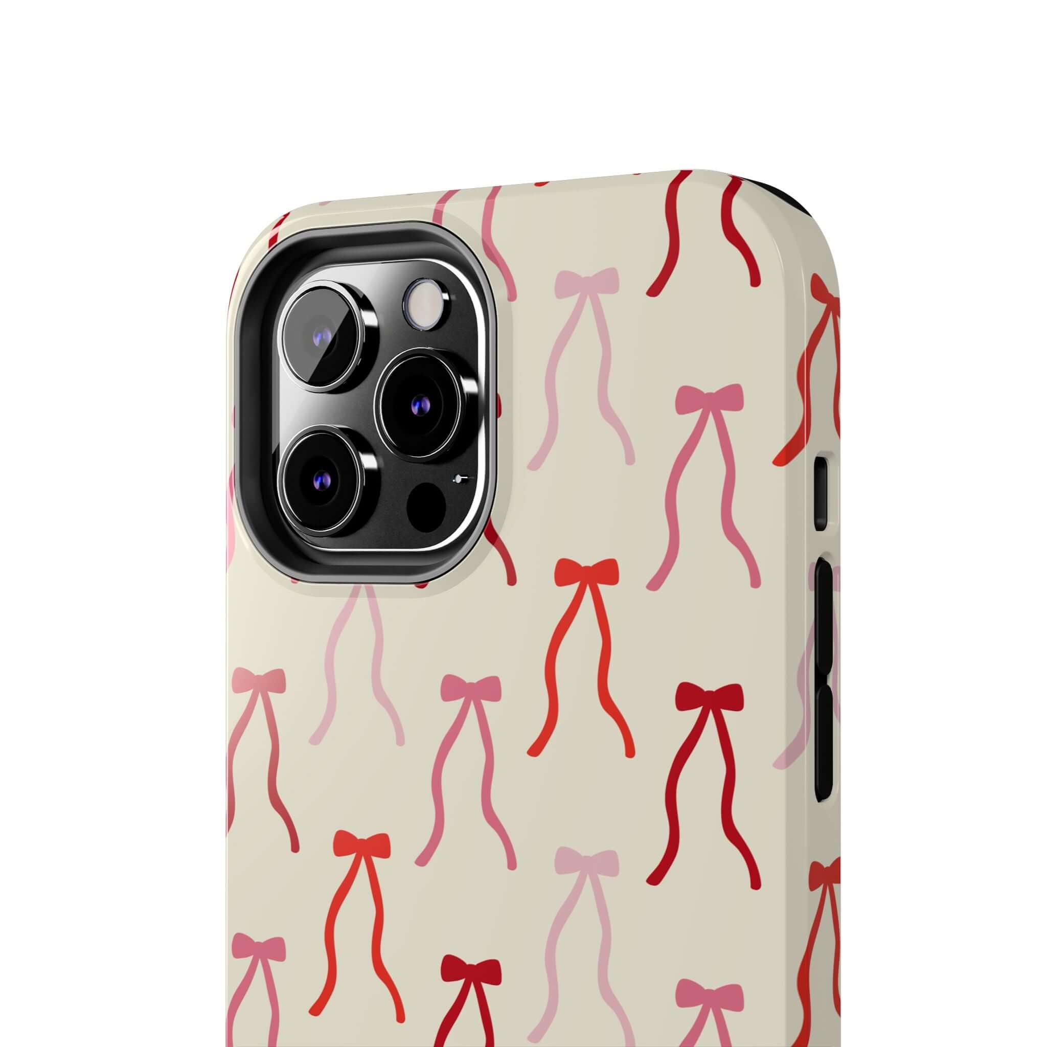 Cute iPhone 16 case with beige background and playful red bow design, perfect for stylish phone protection.