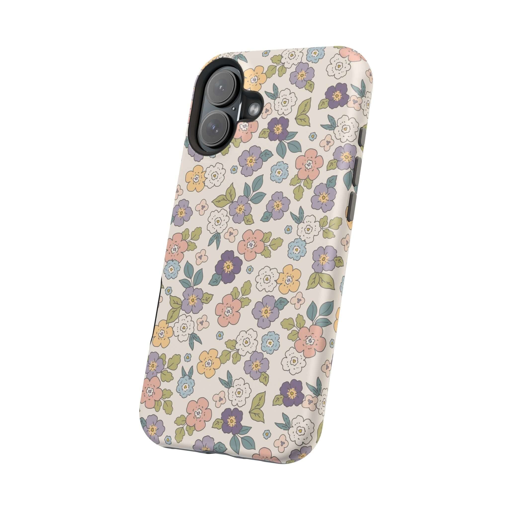 Colorful floral iPhone case featuring ditsy daisies, perfect for stylish users and MagSafe compatible.