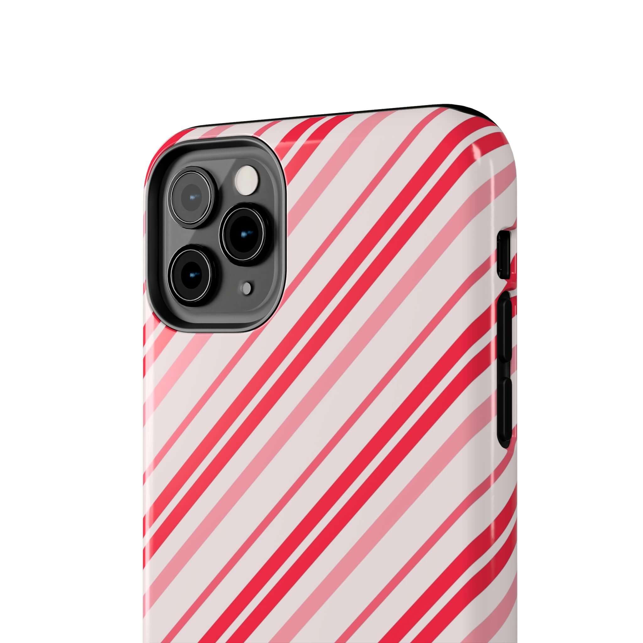 Cute iPhone case with red and white candy cane stripes, perfect for holiday style. Custom phone case design for festive season.