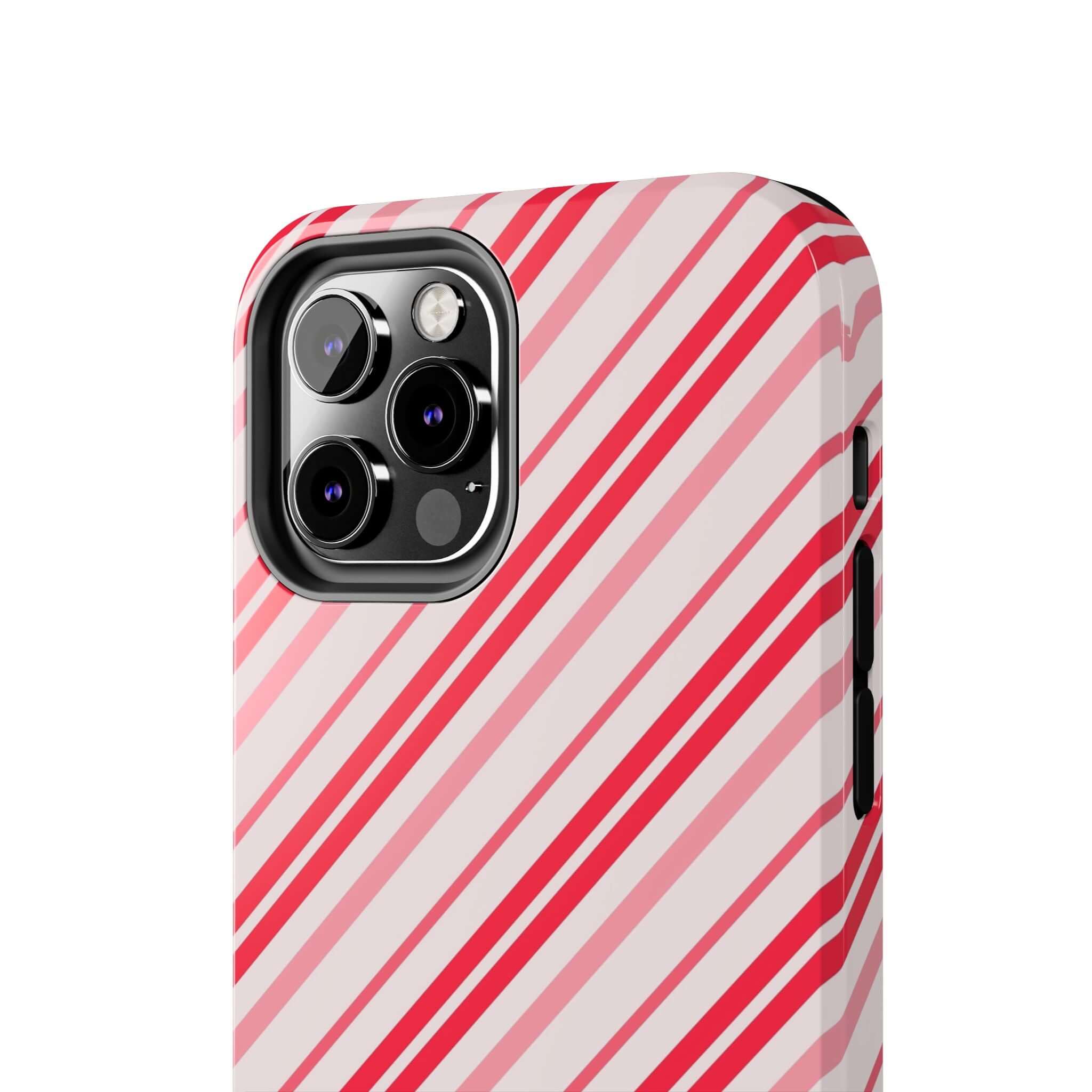 Festive candy cane striped custom iPhone case, perfect for holiday style and gift ideas. Cute phone case design with red and white stripes.