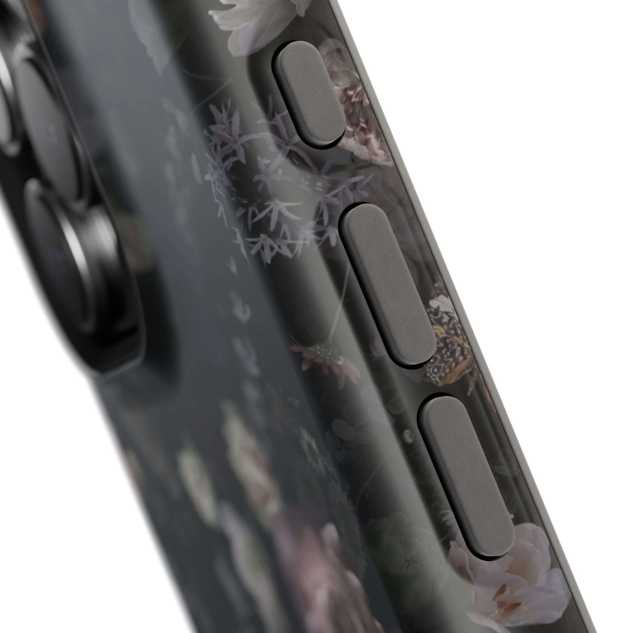 Close-up of Midnight Curse black floral MagSafe iPhone case showcasing its intricate dark rose design with side buttons visible.