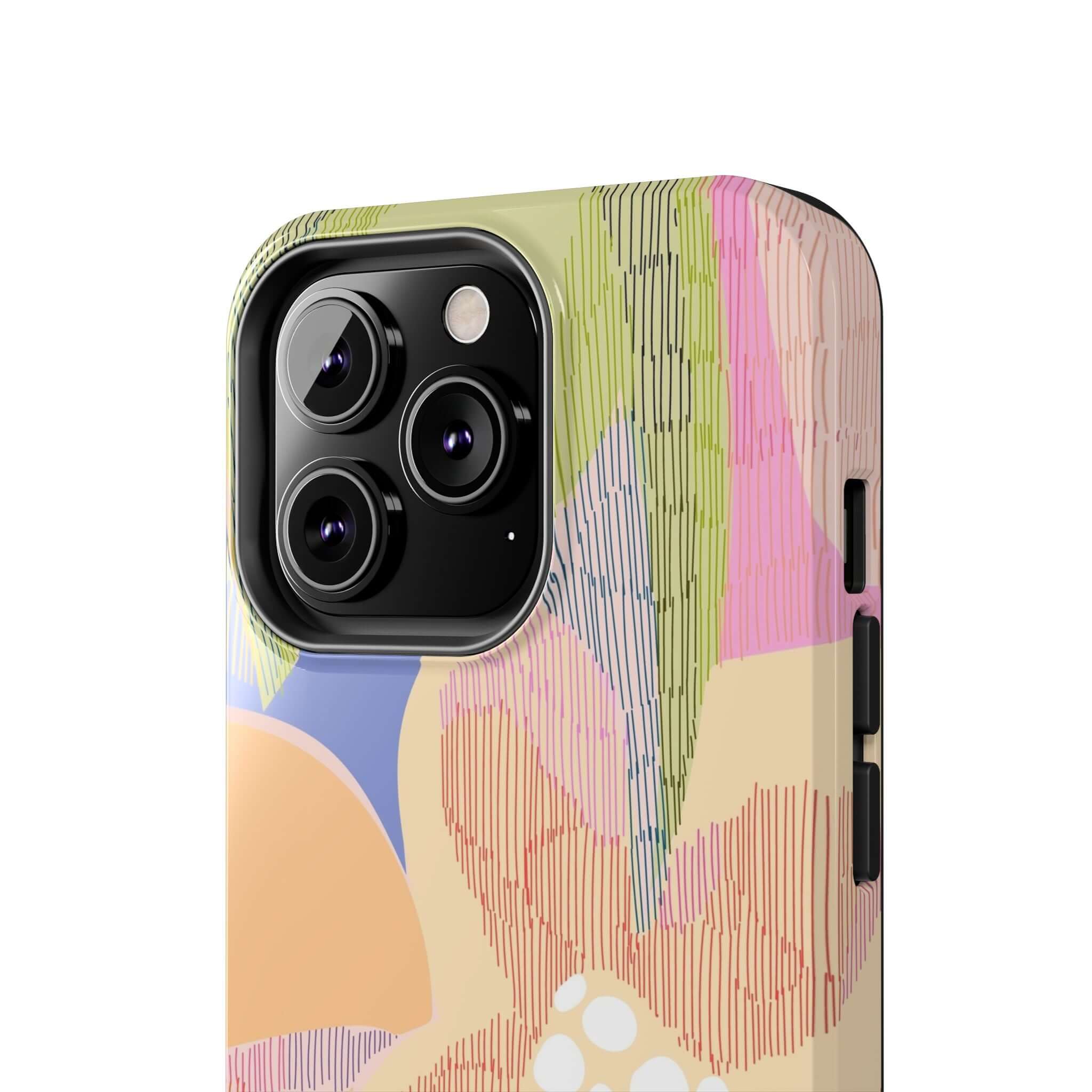 Colorful iPhone case with an abstract floral design on an iPhone 14 Pro Max in close-up view